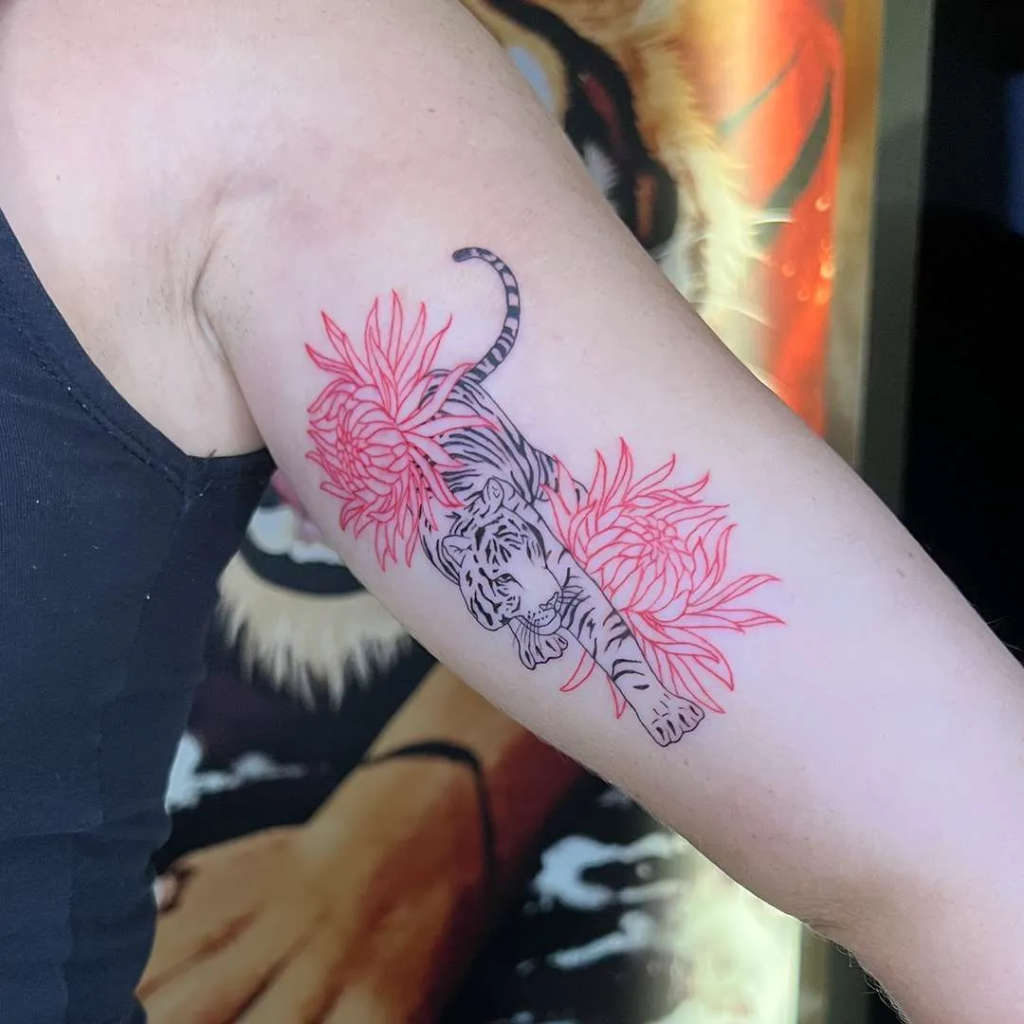 a fine line tiger and flower tattoo that you won't regret.